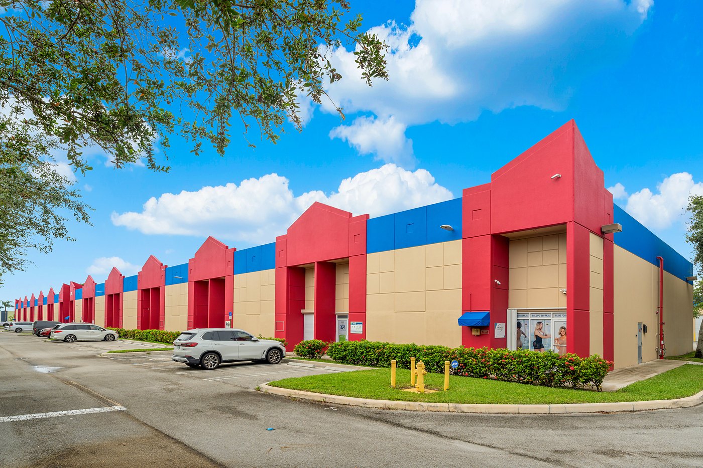 Long row of red entry towers and blue parapets at Cortland Commercial Center II
