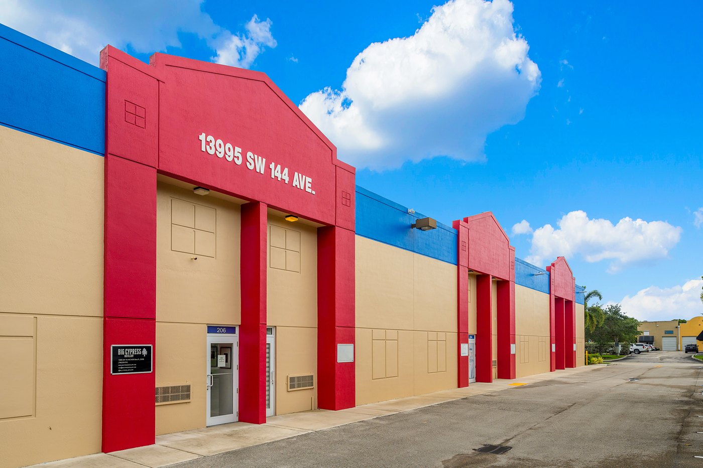 13995 SW 144th Avenue address on the red entry tower at Zacarias Commercial Center II